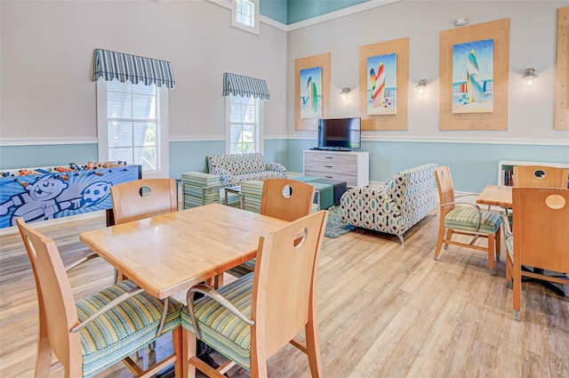 dining space featuring light wood-type flooring