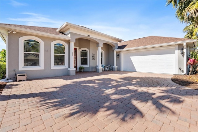 view of front of property with a garage