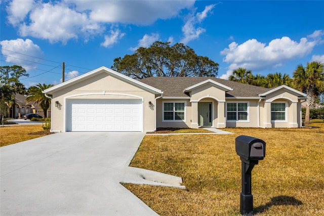 ranch-style house featuring a garage and a front lawn