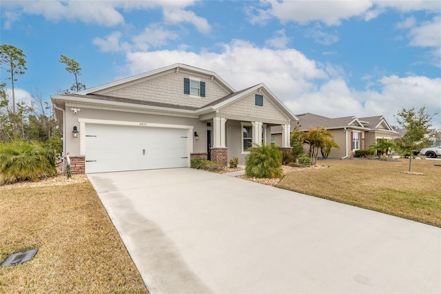 view of front of home with a garage and a front lawn