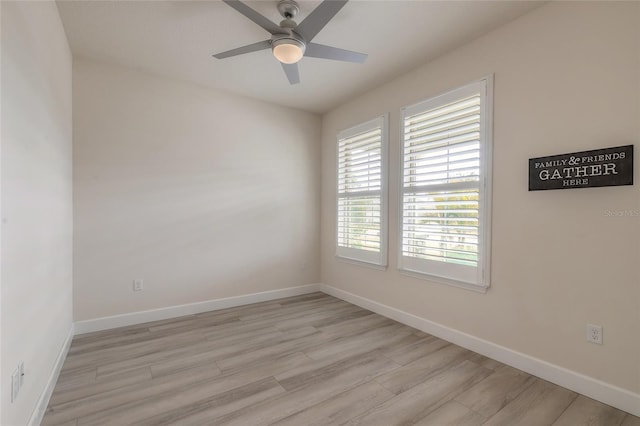 empty room featuring ceiling fan and light hardwood / wood-style floors