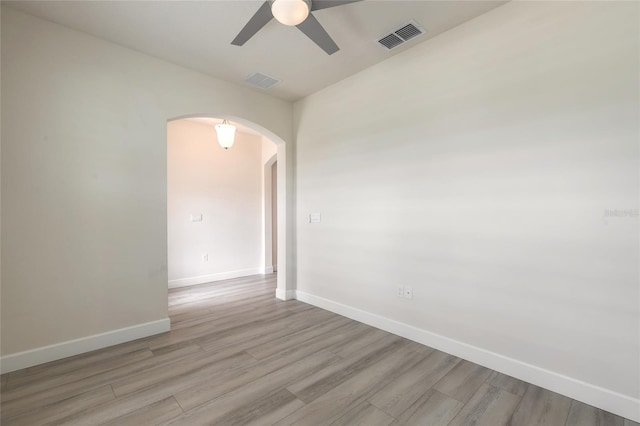 spare room featuring ceiling fan and light hardwood / wood-style floors