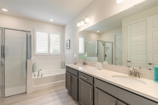 bathroom with vanity and plus walk in shower