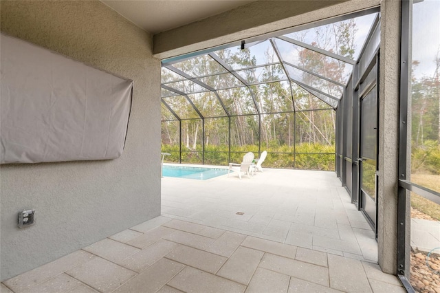 view of pool with a lanai and a patio