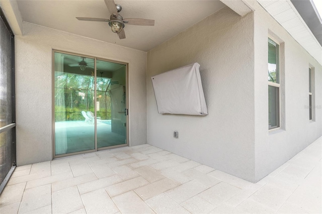 view of patio / terrace featuring ceiling fan