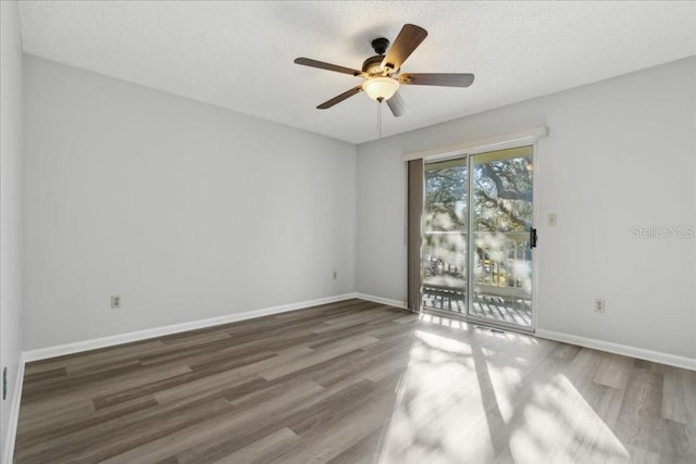 empty room featuring hardwood / wood-style floors, a textured ceiling, and ceiling fan