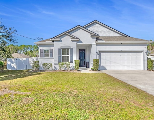 view of front of house with a garage and a front lawn