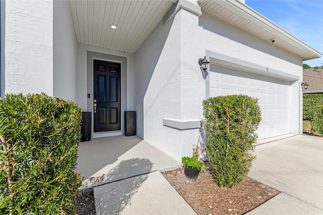 doorway to property featuring a garage