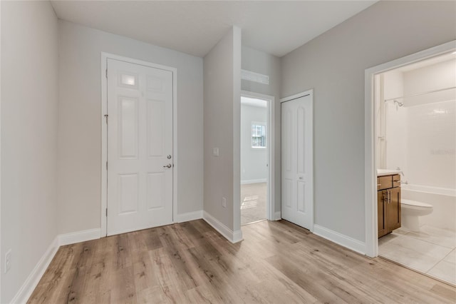 entryway with light hardwood / wood-style floors