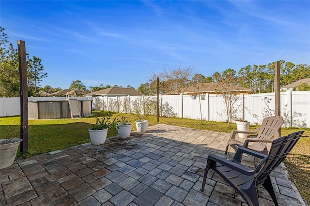 view of patio / terrace featuring a swimming pool