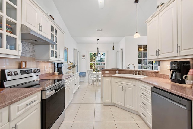 kitchen featuring pendant lighting, dishwasher, sink, white cabinets, and electric stove