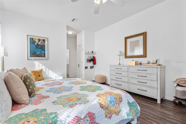 bedroom with dark hardwood / wood-style floors and ceiling fan