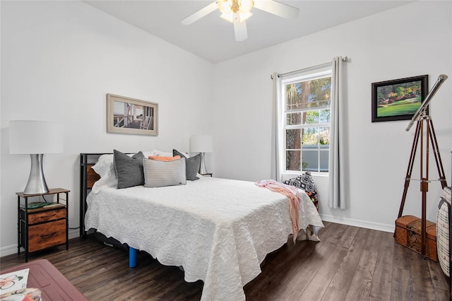 bedroom with ceiling fan and dark hardwood / wood-style flooring