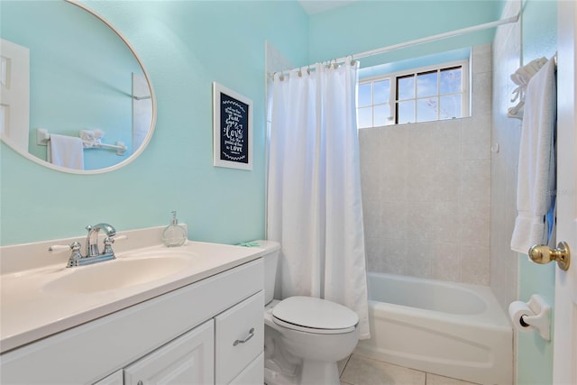 full bathroom with tile patterned flooring, shower / bath combo, vanity, and toilet