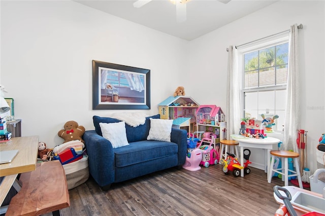 rec room with hardwood / wood-style floors and ceiling fan