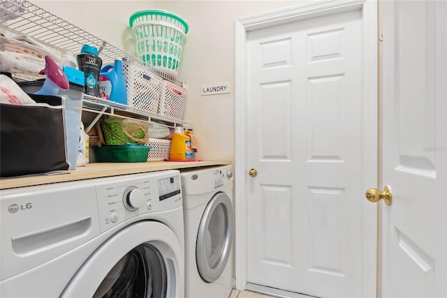 clothes washing area featuring washing machine and dryer