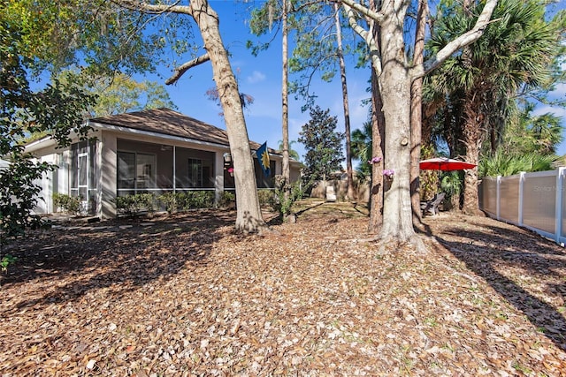 view of yard with a sunroom