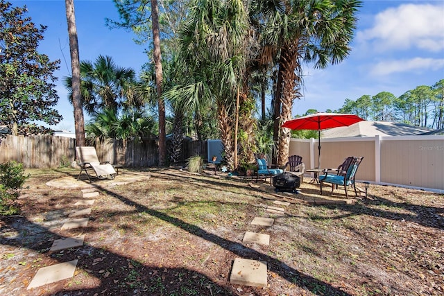 view of yard featuring a fire pit