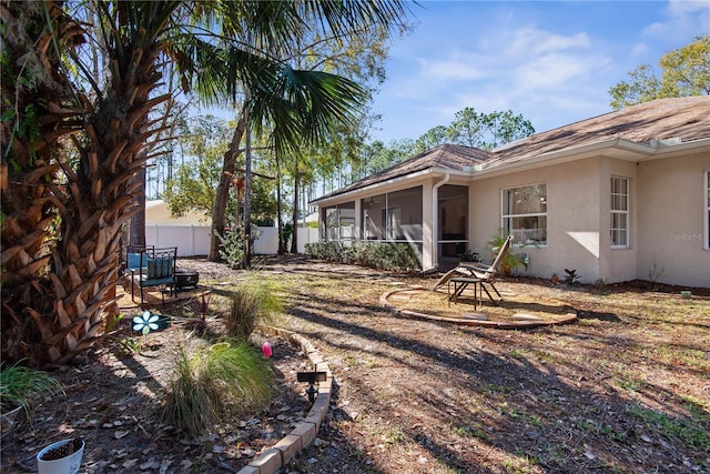 view of yard featuring a sunroom