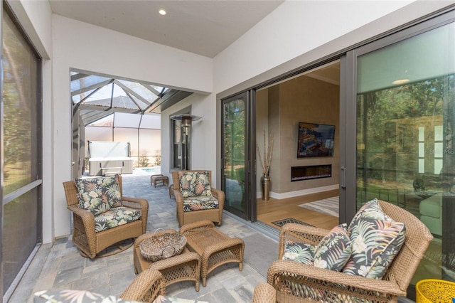 sunroom featuring a fireplace