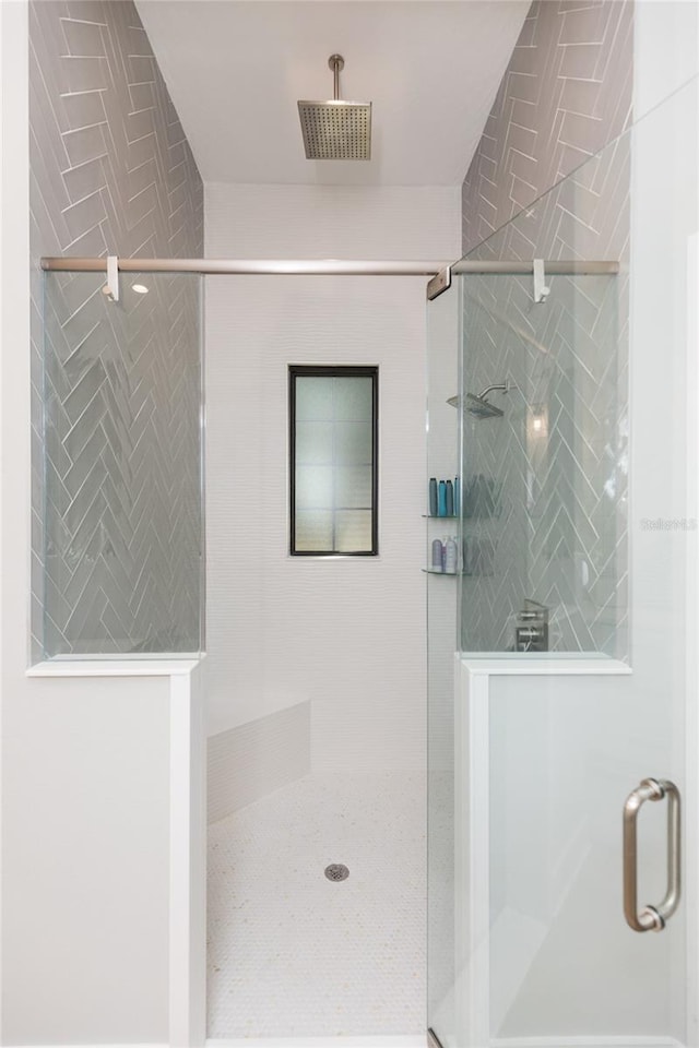 bathroom featuring visible vents and a shower stall