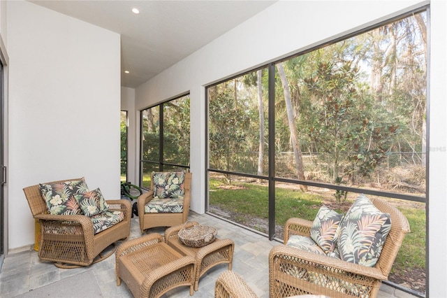 sunroom / solarium featuring an outdoor hangout area