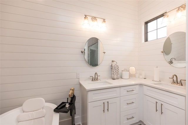 bathroom with double vanity and a sink