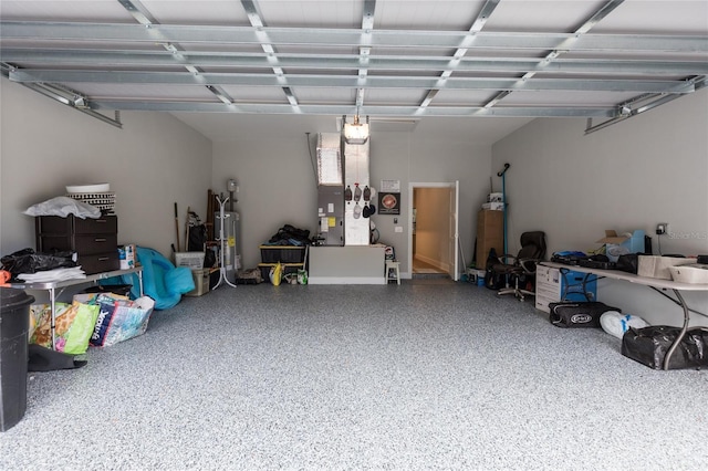 garage featuring gas water heater and heating unit