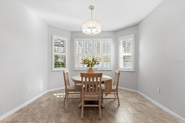 dining room with a chandelier