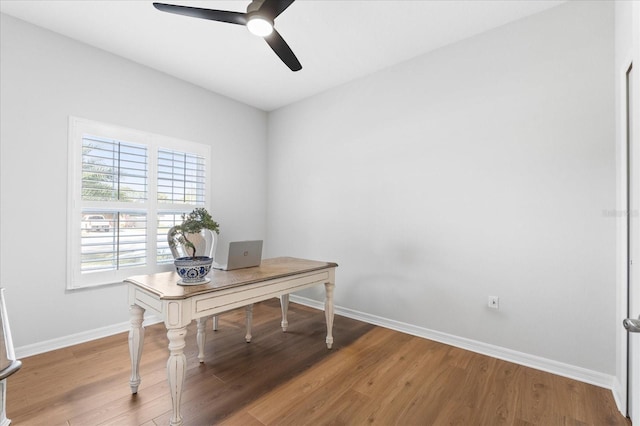 office with ceiling fan and hardwood / wood-style floors