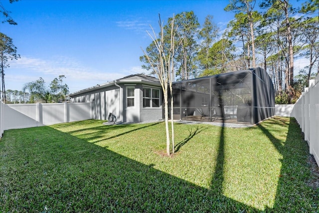 view of yard featuring a patio and glass enclosure