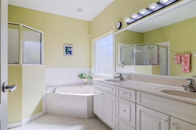 bathroom with tile patterned floors, independent shower and bath, and vanity