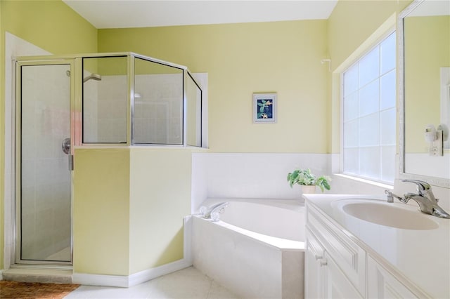 bathroom with vanity, tile patterned floors, and plus walk in shower