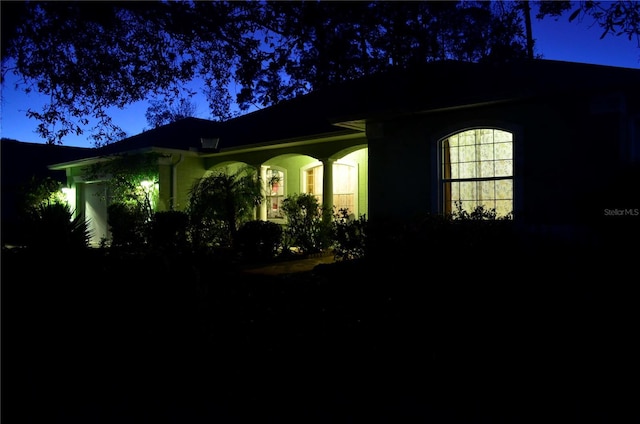 view of property exterior at twilight