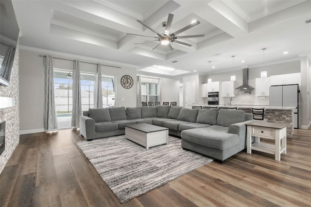 living room with coffered ceiling, crown molding, and dark wood-type flooring