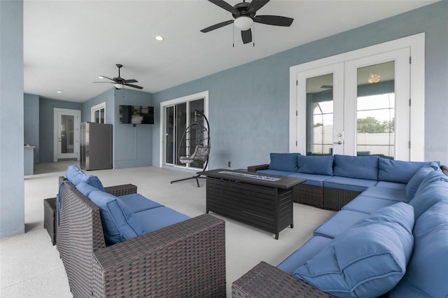 living room featuring light carpet, ceiling fan, and french doors