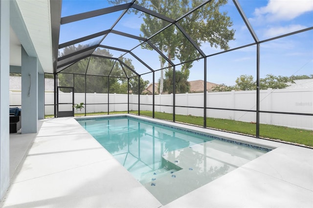 view of pool featuring a patio and glass enclosure