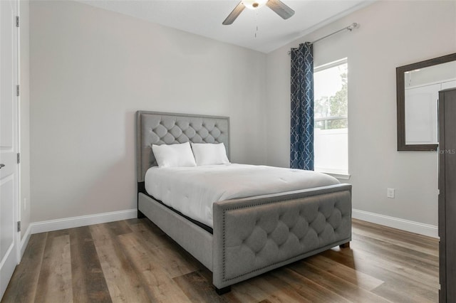 bedroom featuring wood-type flooring and ceiling fan