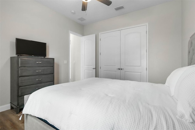 bedroom featuring hardwood / wood-style floors, a closet, and ceiling fan