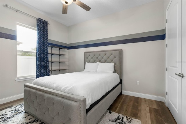 bedroom with hardwood / wood-style flooring and ceiling fan