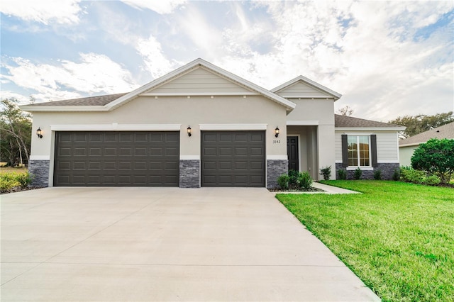 view of front of home with a garage and a front yard