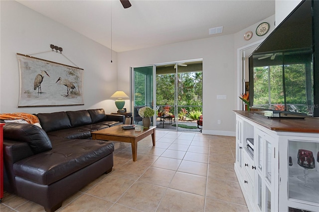 living room with light tile patterned floors and ceiling fan