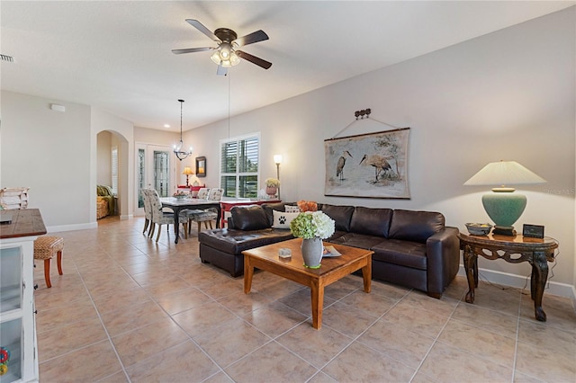 tiled living room with ceiling fan