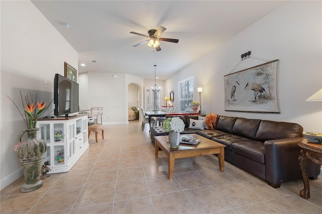 living room with light tile patterned floors and ceiling fan