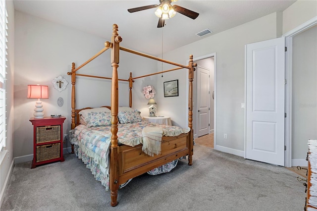 bedroom featuring ceiling fan and light carpet