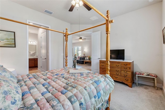 carpeted bedroom with connected bathroom and ceiling fan