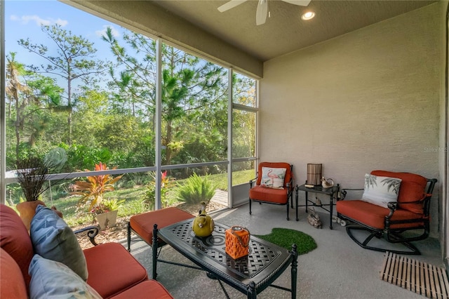 sunroom featuring ceiling fan