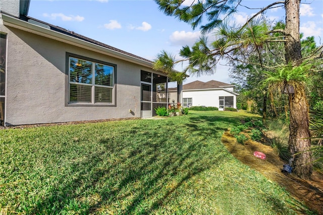 view of yard featuring a sunroom