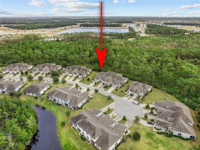 birds eye view of property featuring a water view