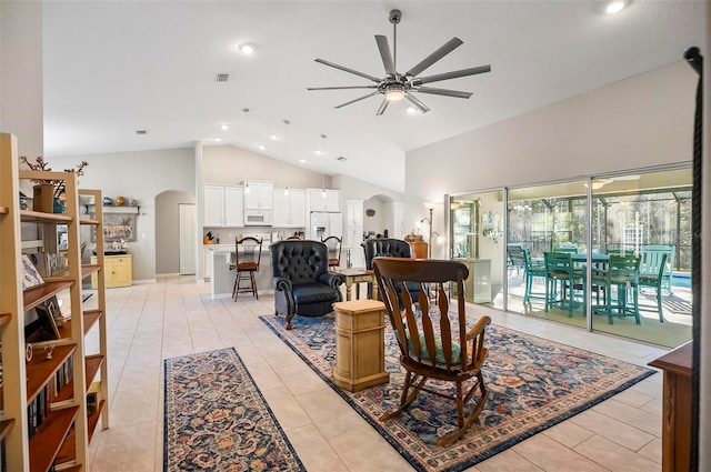 living room featuring light tile patterned flooring, ceiling fan, and high vaulted ceiling